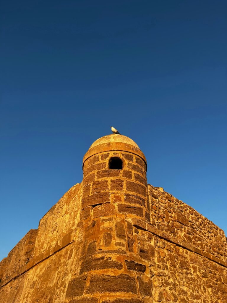 a tall brick tower with a sky background